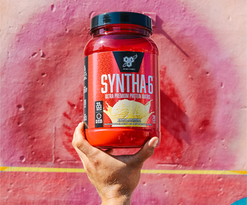 syntha-6 product in front of colourful pink wall