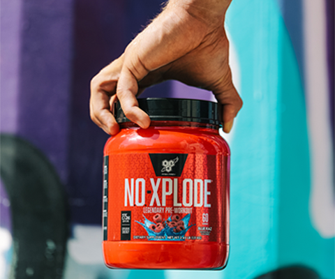 tub of no-xplode in front of colourful blue and purple wall